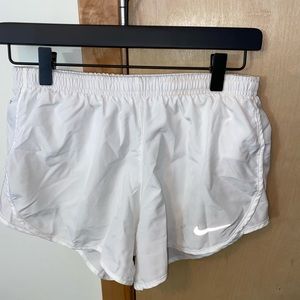 White Nike running shorts